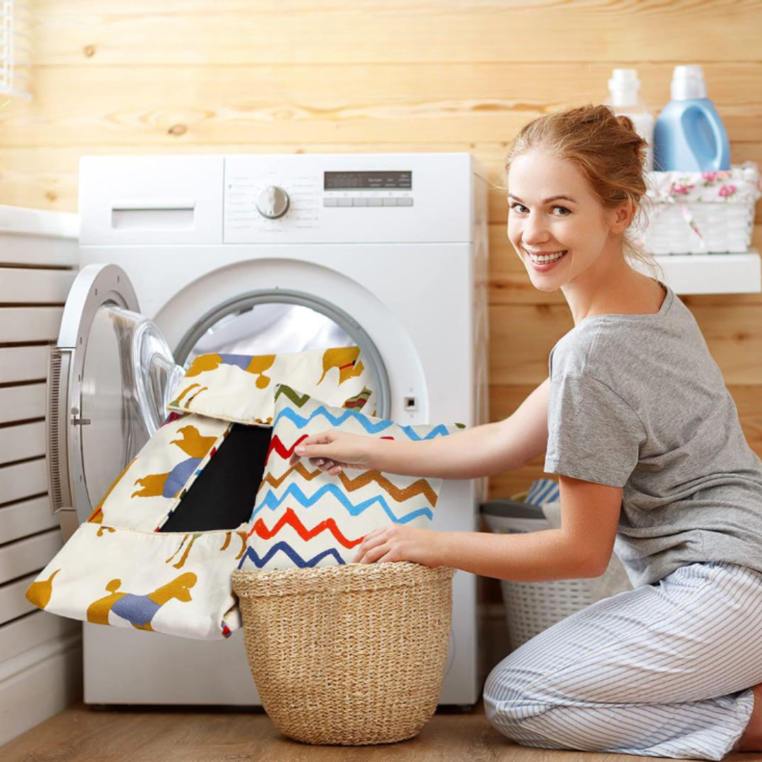Sofa Dog Bed – Washable, Anti-Chew, Ultra Soft & Detachable Woman sorting laundry in a laundry room with a washing machine.