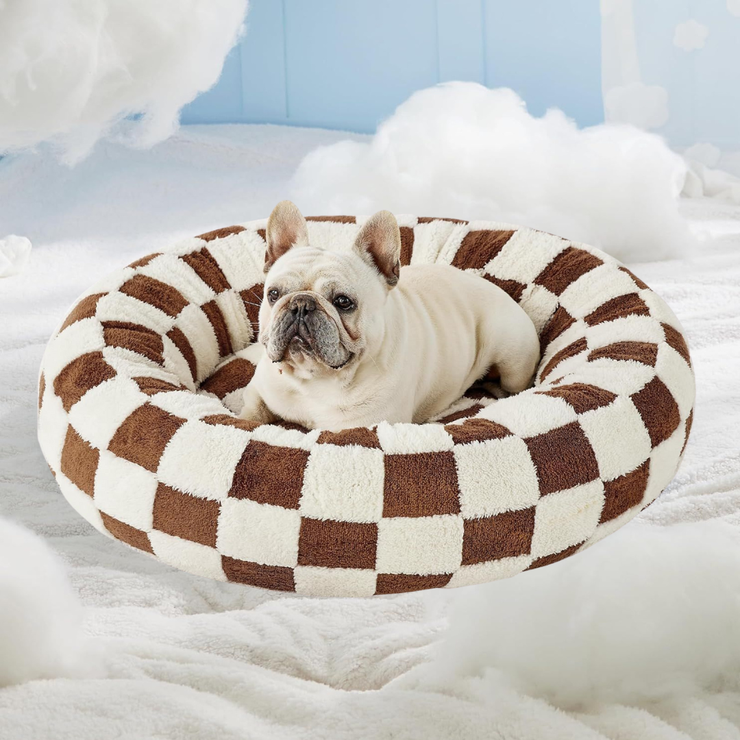 CozyPaw Donut Dog Bed – Modern Design, Soft & Warm, Washable Dog lying on a brown and white checkered pet bed with a soft white background