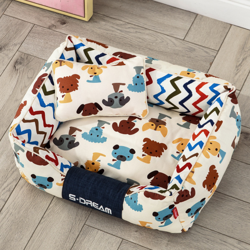Sofa Dog Bed – Washable, Anti-Chew, Ultra Soft & Detachable bag with colorful dog pattern on a wooden floor