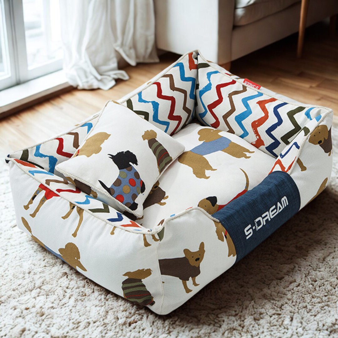  Sofa Dog Bed – Washable, Anti-Chew, Ultra Soft & Detachable Colorful pet bed with dog pattern on a carpeted floor