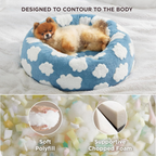 CozyPaw Donut Dog Bed – Modern Design, Soft & Warm, Washable Dog lying on a blue and white cloud-patterned pet bed with close-up of soft polyfill and supportive chopped foam.