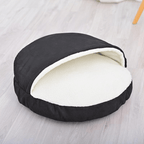 Calming Ultimate Anti-Anxiety Dog Bed – Cozy Hooded BedBlack pet bed with white interior on a light wooden floorJoypup