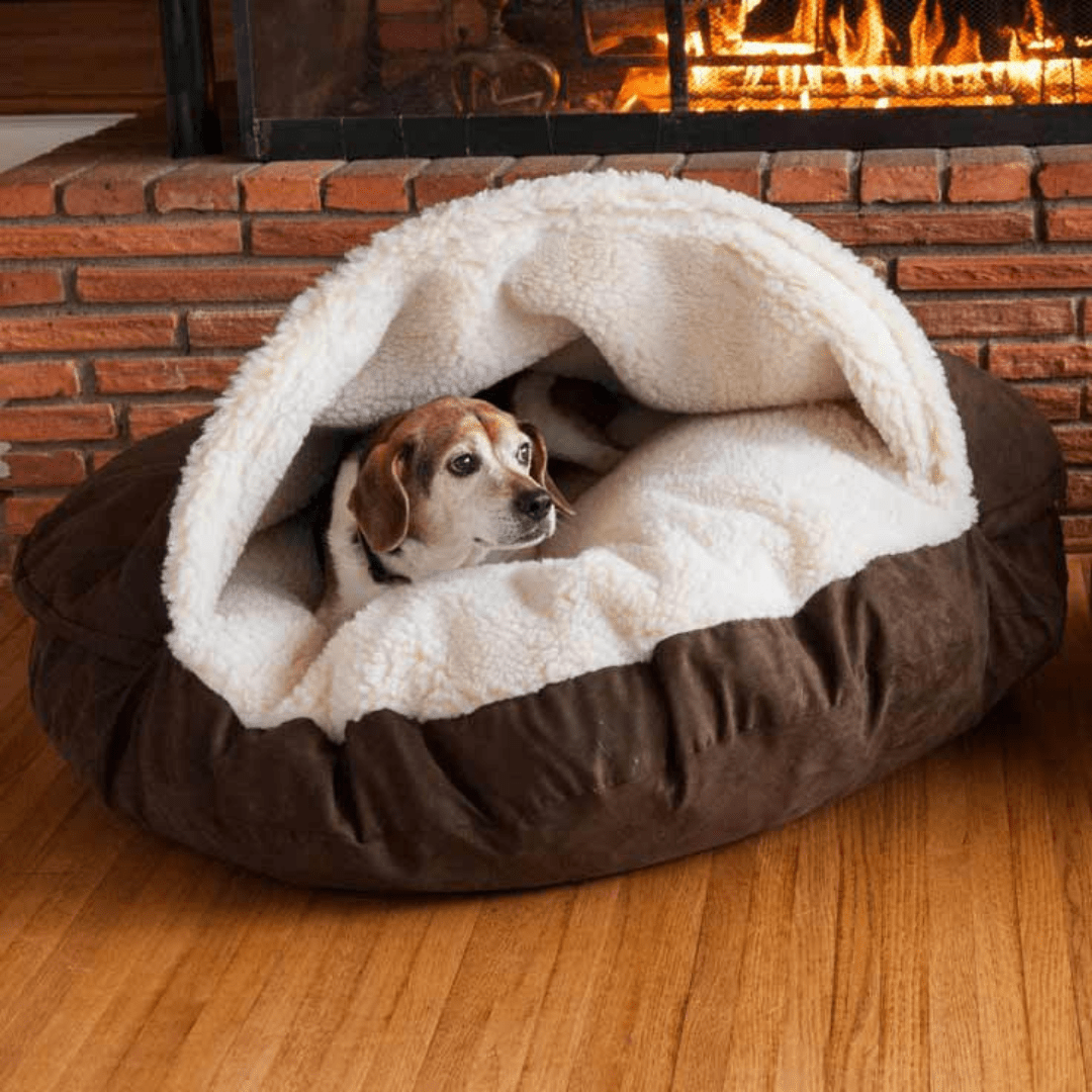 Calming Ultimate Anti-Anxiety Dog Bed – Cozy Hooded BedDog lying in a cozy brown and white pet bed in front of a fireplace.Joypup