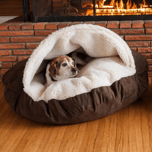 Calming Ultimate Anti-Anxiety Dog Bed – Cozy Hooded BedDog lying in a cozy brown and white pet bed in front of a fireplace.Joypup