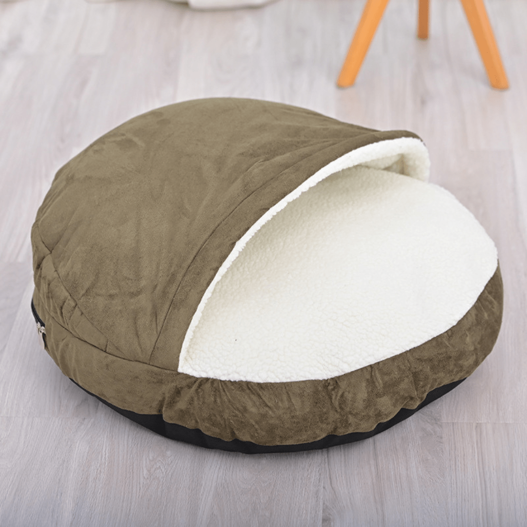 Calming Ultimate Anti-Anxiety Dog Bed – Cozy Hooded BedBrown pet bed with white interior on a light wooden floorJoypup