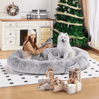 Human Dog Bed – Cozy, Ultra - Comfortable BedWoman with a dog in a fluffy pet bed surrounded by Christmas decorationsJoypup