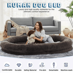Human Dog Bed Woman with a dog in a large donut-shaped pet bed in a living room setting.