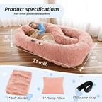 Fluffy pink pet bed with measurements and included items on a wooden floor.