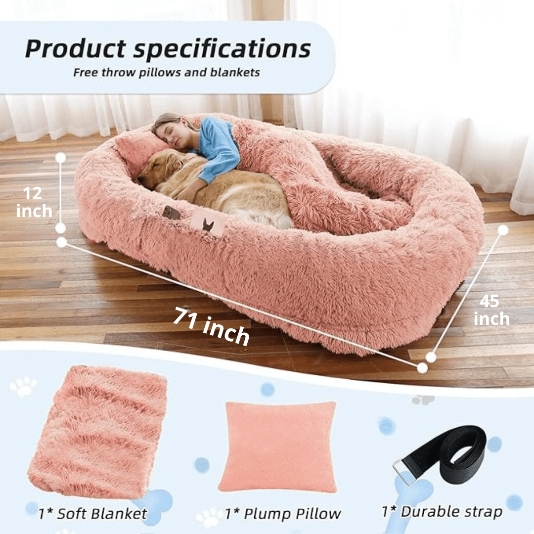 Fluffy pink pet bed with measurements and included items on a wooden floor.