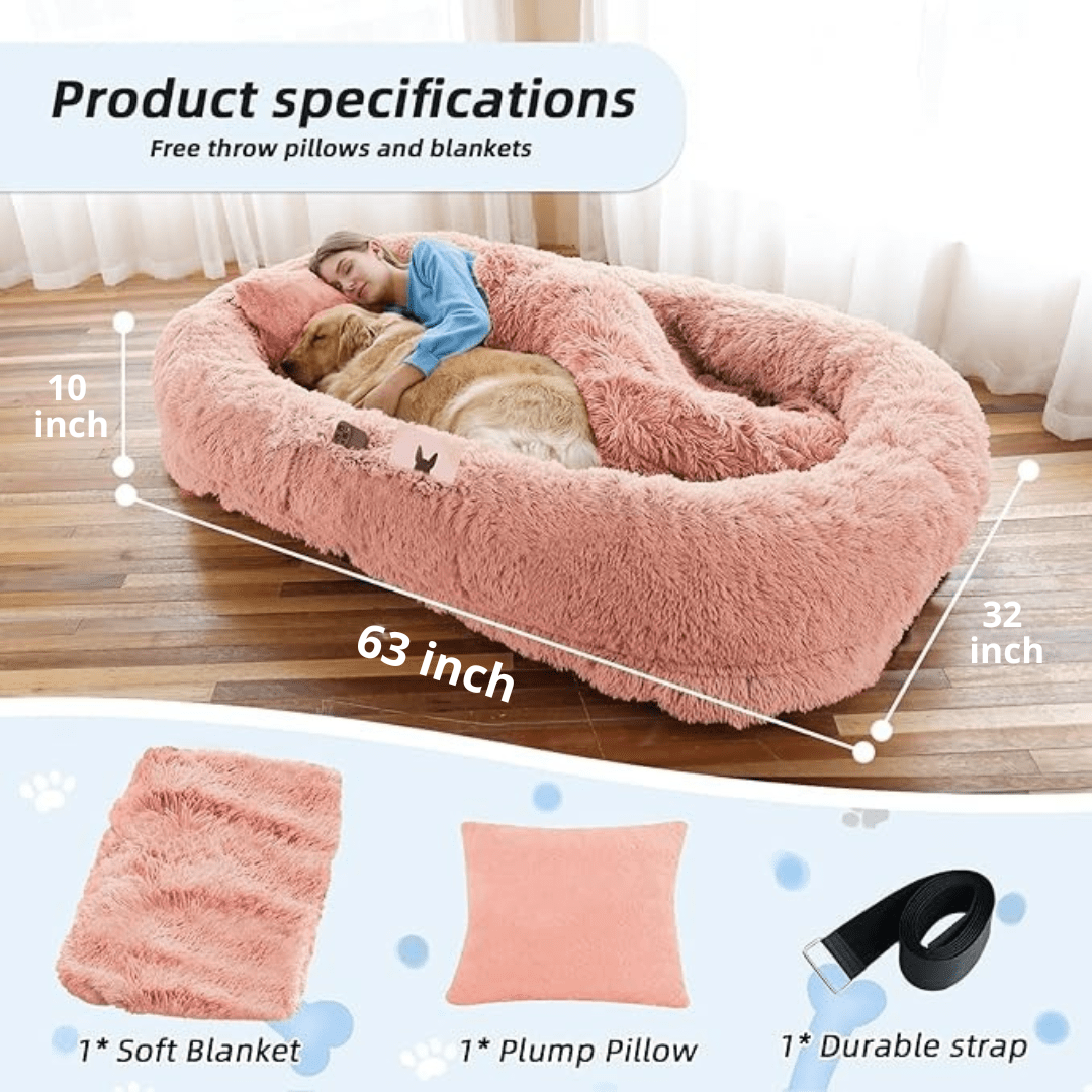 Human Dog Bed – Cozy, Ultra - Comfortable BedFluffy pink pet bed with measurements and accessories on a wooden floor.Joypup