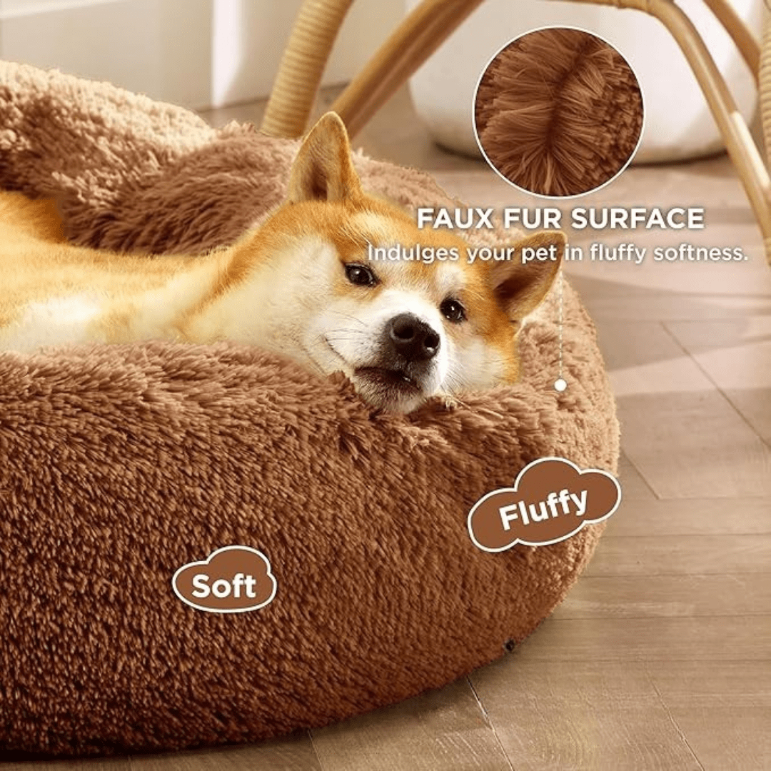 Soft Donut Cuddler Pet Bed - Ultimate Anti-AnxietyDog lying in a brown plush pet bed with text highlighting features.Joypup