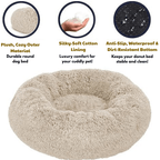 Beige donut dog bed with features highlighted on a white background