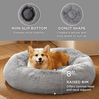 Gray donut-shaped pet bed with a dog inside, featuring text on its features.