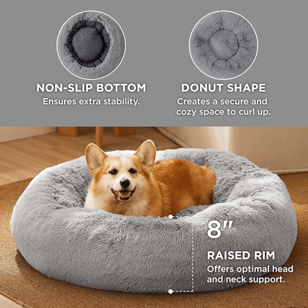 Gray donut-shaped pet bed with a dog inside, featuring text on its features.