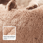 Close-up of a fluffy pink surface with paws on top, labeled 'faux fur surface'.