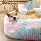 Dog lying on a fluffy, multicolored pet bed with text highlighting its features.
